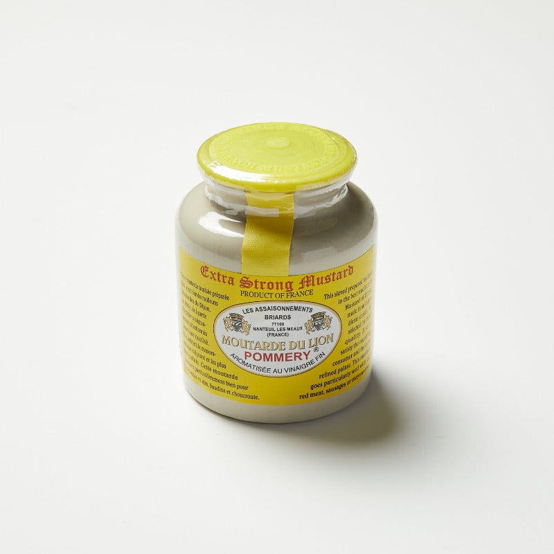 Dijon mustard in a stone pot jar